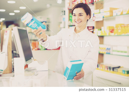 Pharmacist ready to assist in choosing at counter Pharmacist ready to assist in choosing at counter 31337515