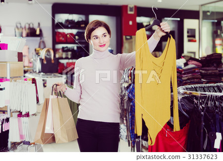 Female 2-30 years old is showing her purchases 31337623