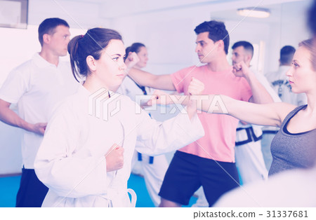 Men and women learn karate 31337681