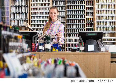 Female seller in art shop Female seller in art shop 31338147