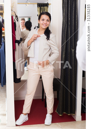 Adult girl purchasing jacket Adult girl purchasing jacket 31338285