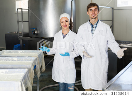 Cheerful adult man and woman on the manufacture Cheerful adult man and woman on the manufacture 31338614