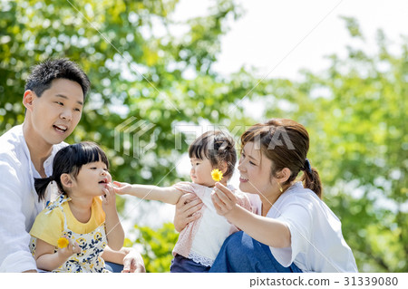 Four people playing in a fresh green park 31339080