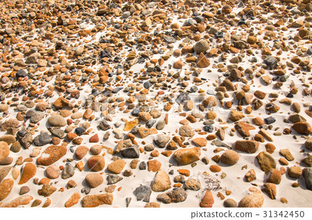 smooth round pebble stones on the sand backgound smooth round pebble stones on the sand backgound 31342450