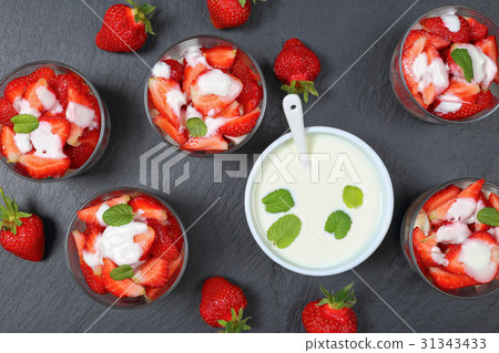 strawberries in glass jars with yogurt strawberries in glass jars with yogurt 31343433