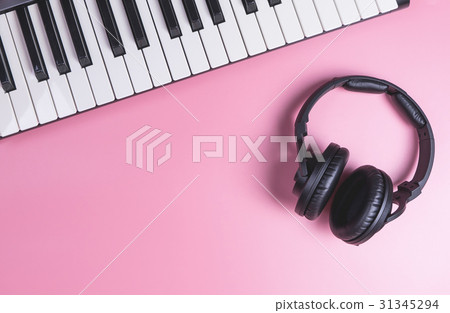 Music Studio Keyboard and Headphone on pink Music Studio Keyboard and Headphone on pink 31345294