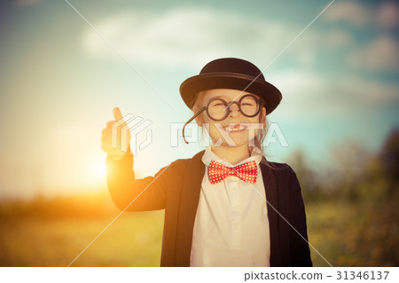 Funny little girl in bow tie and bowler hat Funny little girl in bow tie and bowler hat 31346137