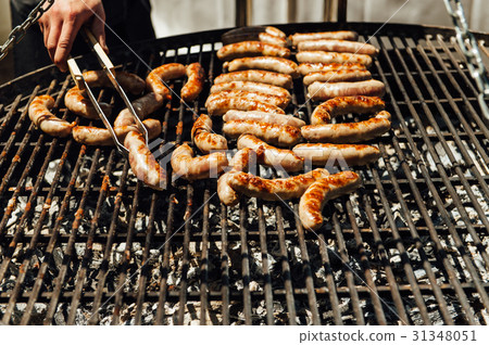 Assorted meat and vegetables grilling over fire Assorted meat and vegetables grilling over fire 31348051
