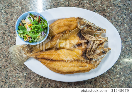Fried sea bass fish in white plate with spicy 31348679