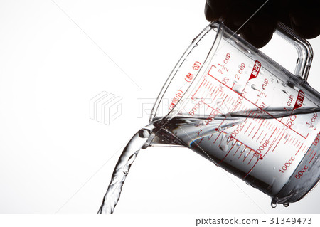 Measuring cup and water Measuring cup and water 31349473