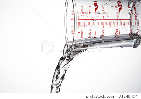 Measuring cup and water Measuring cup and water 31349474