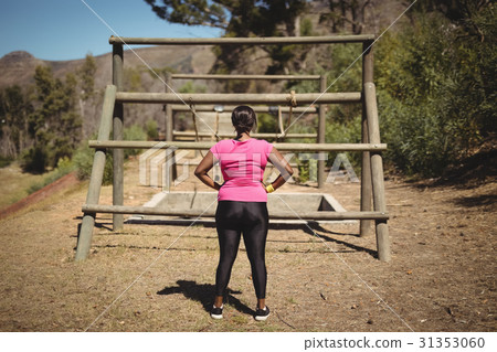 Rear view of woman looking at outdoor equipment Rear view of woman looking at outdoor equipment 31353060