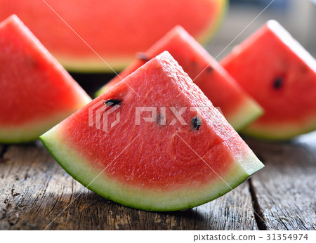 watermelon sliced on wooden background 31354974