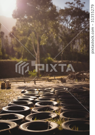 Tyres arranged in boot camp 31355279