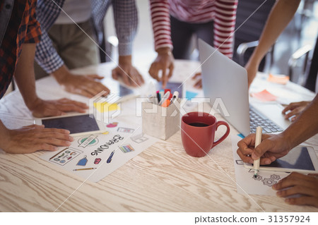 Business people working together on office desk Business people working together on office desk 31357924