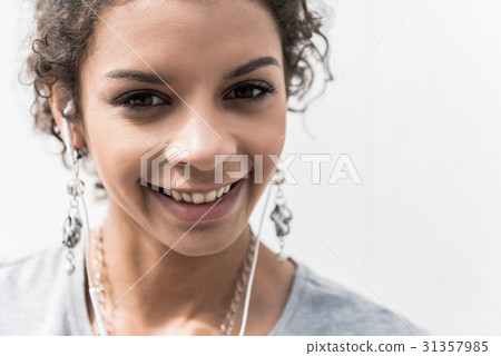 Positive charming girl is resting in open air Positive charming girl is resting in open air 31357985