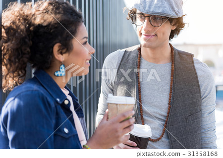 Happy lovers enjoying date on street Happy lovers enjoying date on street 31358168