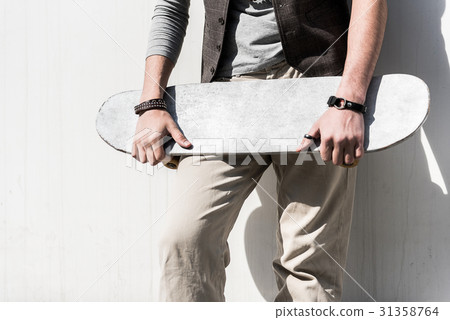Fashionable guy is resting on street 31358764
