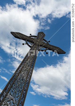 Cross against the sky 31360752