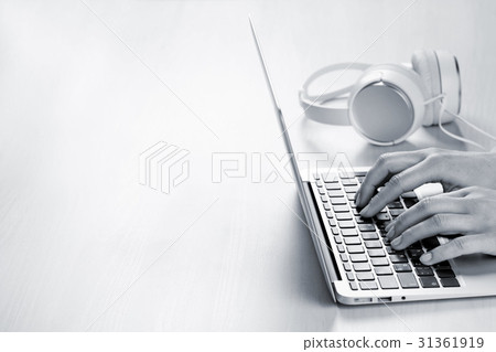 Woman working on laptop. Hands typing on keyboard. 31361919