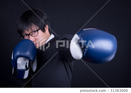 Young Asian business man with boxing gloves 31363000