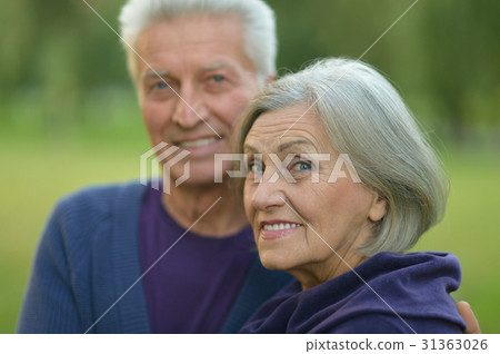 senior couple resting outdoors senior couple resting outdoors 31363026