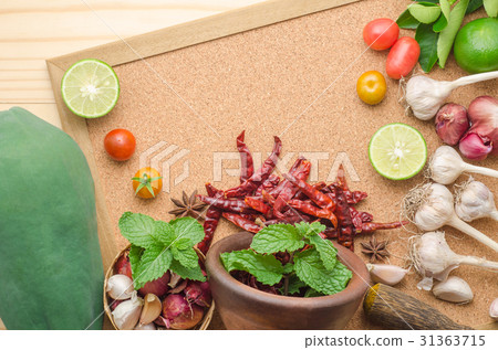 Ingredients for making papaya salad on table.  31363715