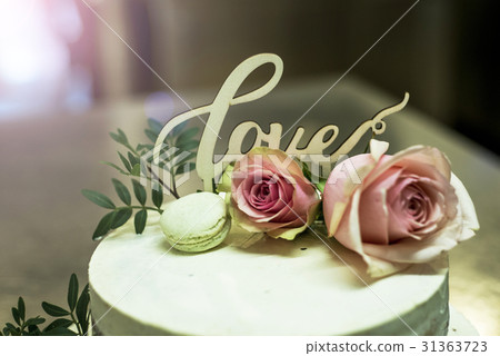 Beautiful wedding cake with cream With text Love Beautiful wedding cake with cream With text Love 31363723