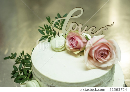 Beautiful wedding cake with cream With text Love Beautiful wedding cake with cream With text Love 31363724