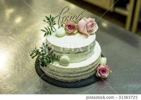 Beautiful wedding cake with cream With text Love Beautiful wedding cake with cream With text Love 31363725