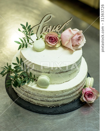 Beautiful wedding cake with cream With text Love Beautiful wedding cake with cream With text Love 31363726