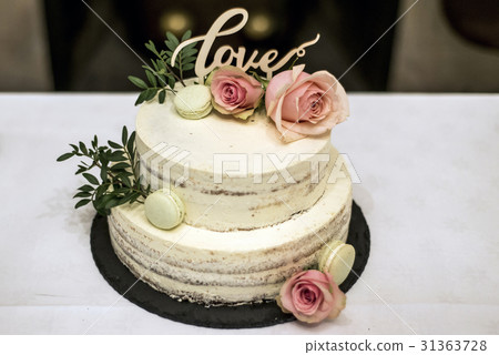 Beautiful wedding cake with cream With text Love Beautiful wedding cake with cream With text Love 31363728