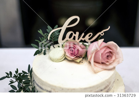Beautiful wedding cake with cream With text Love Beautiful wedding cake with cream With text Love 31363729