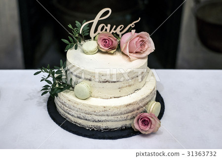 Beautiful wedding cake with cream With text Love Beautiful wedding cake with cream With text Love 31363732