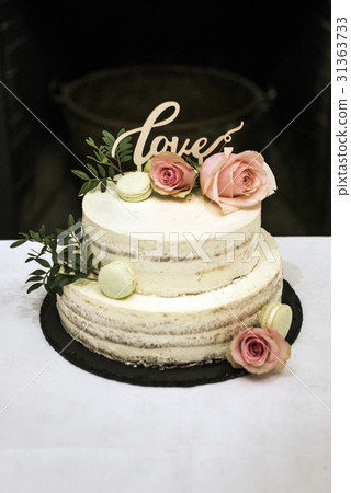Beautiful wedding cake with cream With text Love 31363733