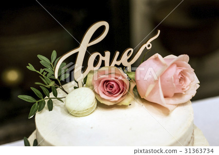 Beautiful wedding cake with cream With text Love Beautiful wedding cake with cream With text Love 31363734