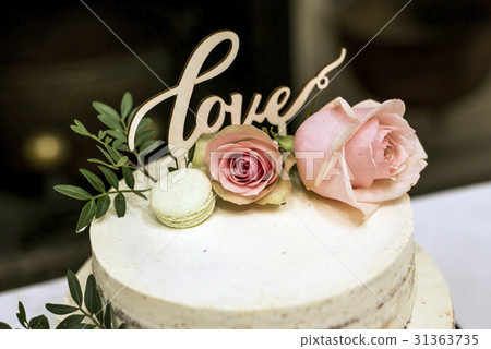 Beautiful wedding cake with cream With text Love Beautiful wedding cake with cream With text Love 31363735