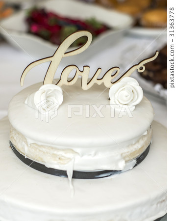 Beautiful wedding cake with cream With text Love Beautiful wedding cake with cream With text Love 31363778
