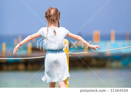 Little girl at the beach during caribbean vacation Little girl at the beach during caribbean vacation 31364509