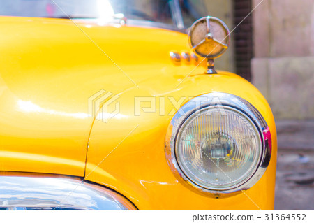 Closeup of yellow classic vintage car in Old 31364552