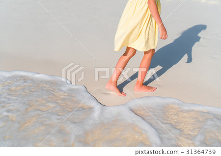 Closeup legs of little girl at shallow water Closeup legs of little girl at shallow water 31364739