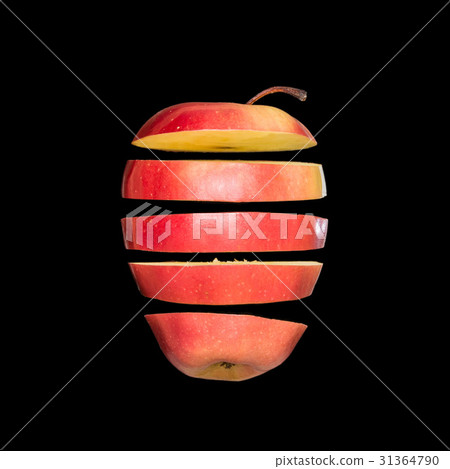 Flying apple. Sliced red apple isolated on black background. Levity fruit floating in the air. 31364790