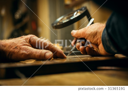 Senior wood carving professional during work 31365191