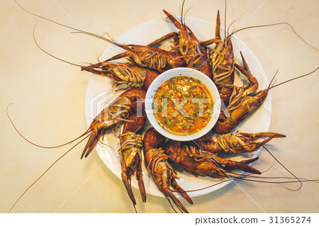 Boiled shrimp on table with seafood sauce 31365274