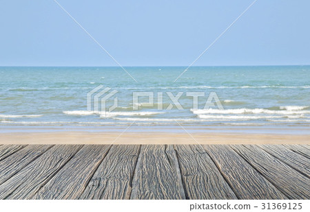 wood floor on sand beach with sea and blue sky wood floor on sand beach with sea and blue sky 31369125