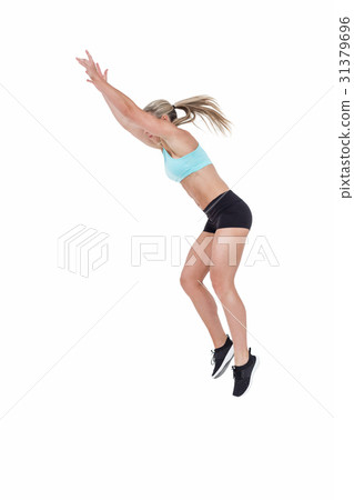 Female athlete jumping 31379696