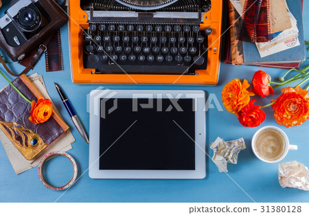Workspace with vintage orange typewriter Workspace with vintage orange typewriter 31380128