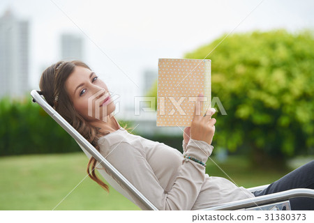 Relaxing with a book 31380373