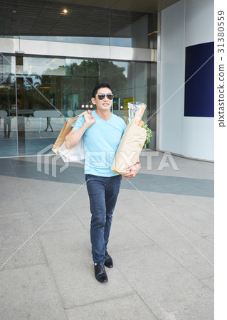 Leaving supermarket 31380559