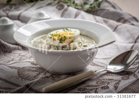 Sorrel soup with egg in white bowl. Sorrel soup with egg in white bowl. 31381677